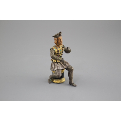 175 - An Austro-Hungarian gilt and white metal figure of a seated knight, with jewelled decoration and har... 