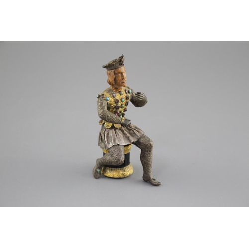 175 - An Austro-Hungarian gilt and white metal figure of a seated knight, with jewelled decoration and har... 