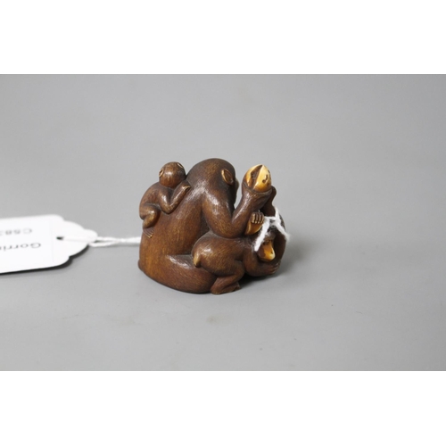 176 - A Japanese stained ivory okimono carved as a group of apes, width 4.5cm, height 3.5cm Condition: Goo... 