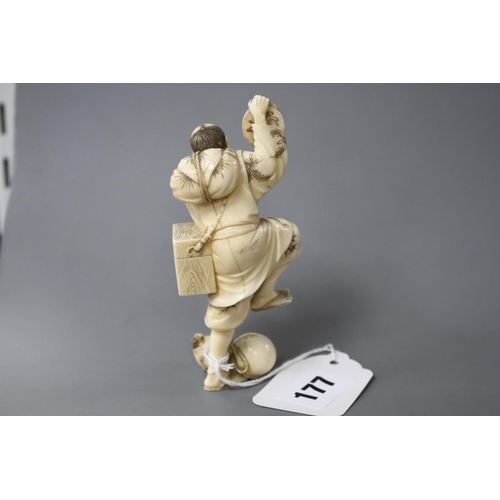 177 - A Japanese carved ivory figure of an entertainer startled by a rat, late Meiji period, signed, heigh... 