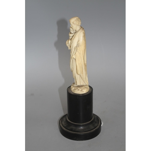 18 - A 19th century Dieppe carved ivory figure of St Joseph holding the Christ child, 16cm, on ebony socl... 