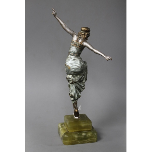 183 - An Art Deco silvered bronze figure of a dancing girl, Paul Phillipe, on signed onyx plinth, height 2... 