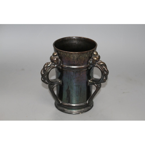 20 - A Dickerware black lustre three handed tyg, early 20th century, indistinct impressed mark, height 18... 