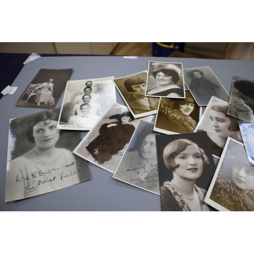 202 - A collection of approximately forty autographed photographs and postcards of early 20th century ente... 