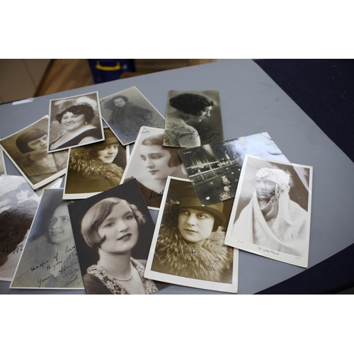 202 - A collection of approximately forty autographed photographs and postcards of early 20th century ente... 