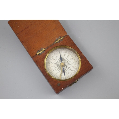 204 - An early 19th century mahogany cased pocket compass, the dial marked in quadrants of ten degree divi... 