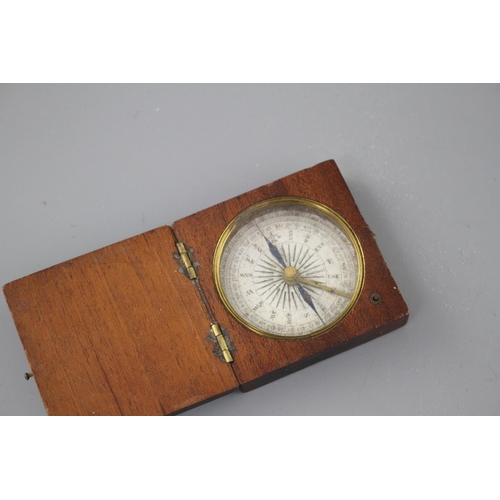 204 - An early 19th century mahogany cased pocket compass, the dial marked in quadrants of ten degree divi... 