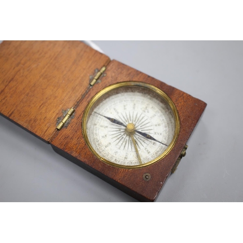 204 - An early 19th century mahogany cased pocket compass, the dial marked in quadrants of ten degree divi... 