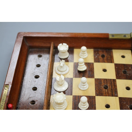 209 - A late 19th century Jaques, London Travelling 'In Statu Quo' travelling chess set, the folding fiddl... 