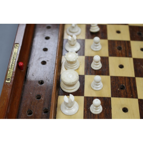 209 - A late 19th century Jaques, London Travelling 'In Statu Quo' travelling chess set, the folding fiddl... 