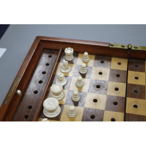 212 - A late 19th century Jaques, London Travelling 'In Statu Quo' travelling chess set, the original leat... 