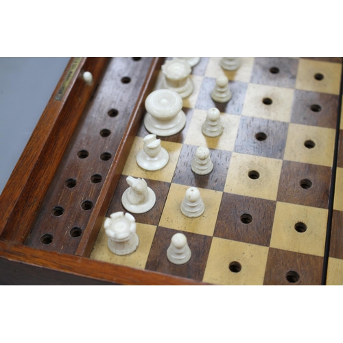 212 - A late 19th century Jaques, London Travelling 'In Statu Quo' travelling chess set, the original leat... 