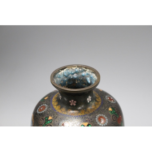 24 - A Japanese cloisonne vase, with mons decoration, 27cm Condition: One distinct bruise going down to t... 