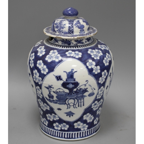 26 - A 19th century Chinese blue and white jar, with panelled decoration, height 28cm and an associated v... 