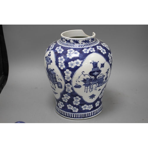 26 - A 19th century Chinese blue and white jar, with panelled decoration, height 28cm and an associated v... 