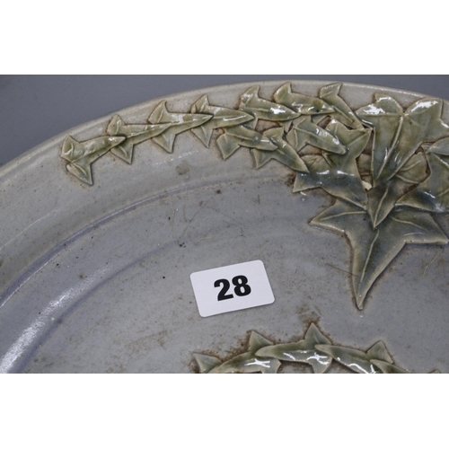 28 - A Studio pottery tray, decorated with ivy leaves, seal mark to rim JC, diameter 35cm Condition: A li... 