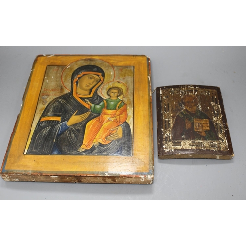 31 - A 19th century Russian tempera on wood icon, 31 x 26cm and another smaller icon, 17.5 x 13cm Conditi... 