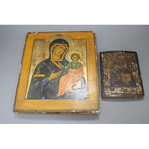 31 - A 19th century Russian tempera on wood icon, 31 x 26cm and another smaller icon, 17.5 x 13cm Conditi... 