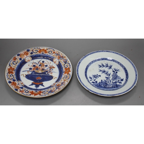 32 - A Chinese Imari plate decorated with flowers in an urn, 25cm and a blue and white plate, 23cm Condit... 