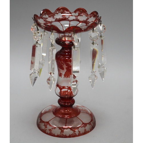 36 - A late 19th century Bohemian ruby overlaid glass table lustre, with spear shaped drops and engraved ... 