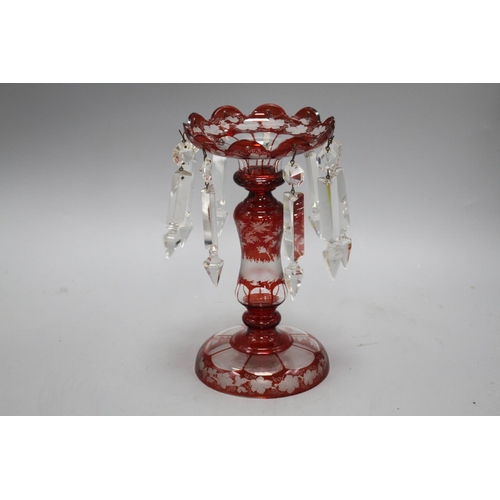 36 - A late 19th century Bohemian ruby overlaid glass table lustre, with spear shaped drops and engraved ... 