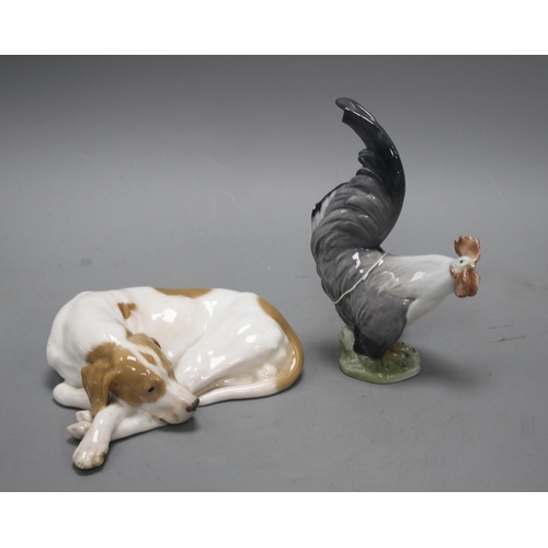 37 - A Royal Copenhagen recumbent dog, model 1634 and a cockerel, model 1025, 20cm and 19.3cm Condition: ... 