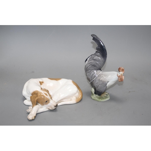 37 - A Royal Copenhagen recumbent dog, model 1634 and a cockerel, model 1025, 20cm and 19.3cm Condition: ... 