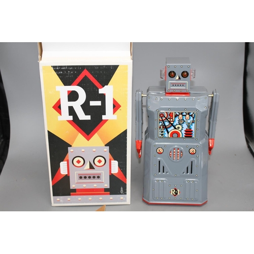 39 - Four collectors' robots, various, including a Rocket Toys R-1, two battery-operated ME 100 Space Wal... 