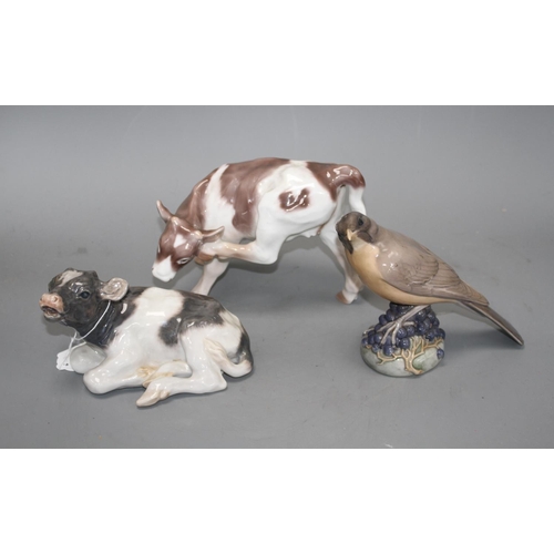 45 - Two Royal Copenhagen figures of a bird, model 1235 and a calf, model 1072 and a Bing & Grondahl calf... 