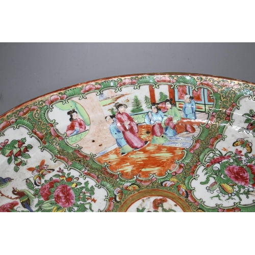 50 - A 19th century Cantonese porcelain oval dish, decorated with panels of figures and birds, 42 x 34cm,... 