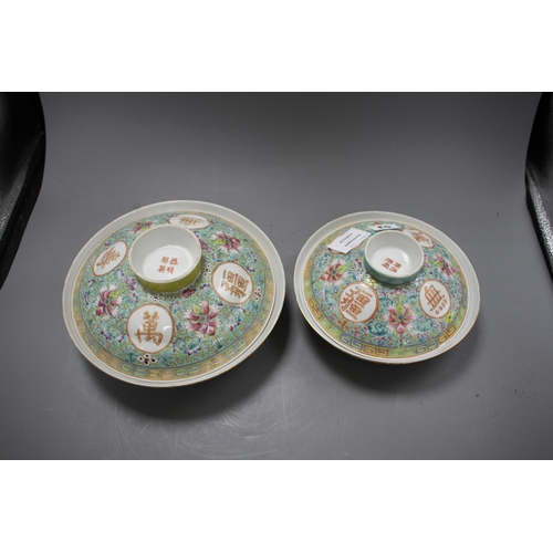 53 - Two graduated Chinese famille rose bowls and cover, 20th century, each decorated with inscriptions a... 