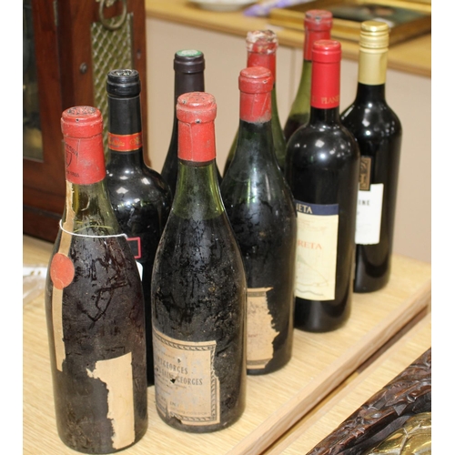 56 - Nine assorted bottles of wine: Burgundy with no label, J. Mommessia to the cap; Badgers Creek Shiraz... 