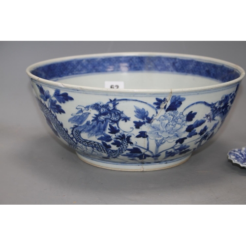 62 - A large Chinese blue and white bowl, 29.5cm a prunus jar, height 12cm and a Kangxi blue and white fl... 