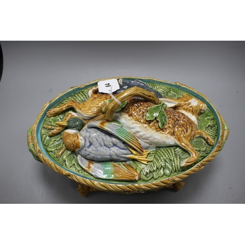 64 - A Mintons majolica game tureen, with hare and poultry lid and oak leaf base, impressed marks, 36cm C... 