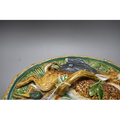 64 - A Mintons majolica game tureen, with hare and poultry lid and oak leaf base, impressed marks, 36cm C... 