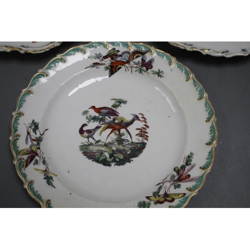 85 - A Chelsea gold anchor 'bird and insect' plate and a similar pair of floral plates, c. 1765, 22 and 2... 