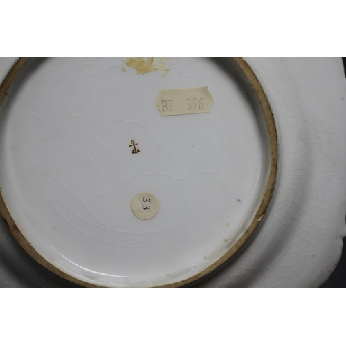 85 - A Chelsea gold anchor 'bird and insect' plate and a similar pair of floral plates, c. 1765, 22 and 2... 