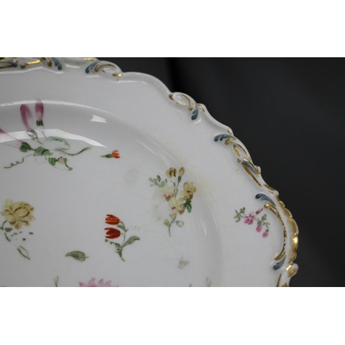 85 - A Chelsea gold anchor 'bird and insect' plate and a similar pair of floral plates, c. 1765, 22 and 2... 