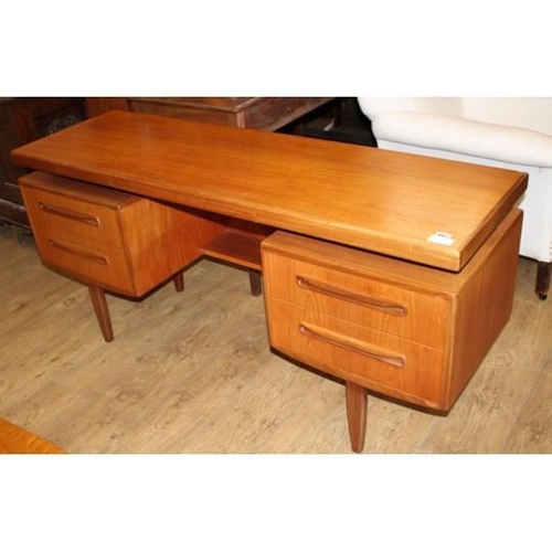 881 - A 1950's G-Plan teak dressing table, fitted five drawers, W.152cm D.46cm H.70cm Condition: A little ... 