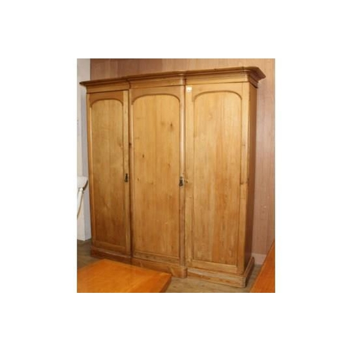 883 - A late Victorian pine breakfront wardrobe, W.200cm D.74cm H.206cm Condition: Some minor dents and sc... 