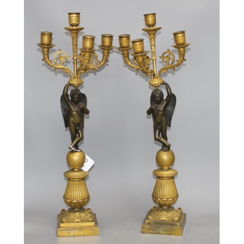 93 - A pair of 19th century French bronze and ormolu candelabra, with scrolling branches, cherub stems an... 