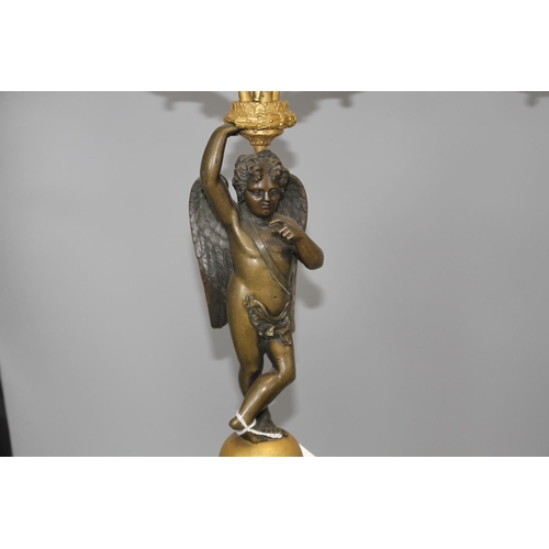 93 - A pair of 19th century French bronze and ormolu candelabra, with scrolling branches, cherub stems an... 