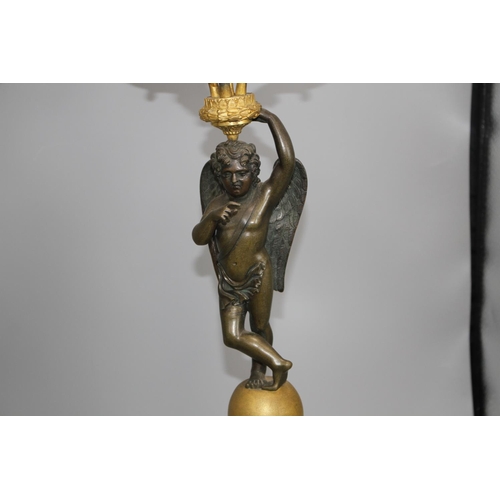 93 - A pair of 19th century French bronze and ormolu candelabra, with scrolling branches, cherub stems an... 