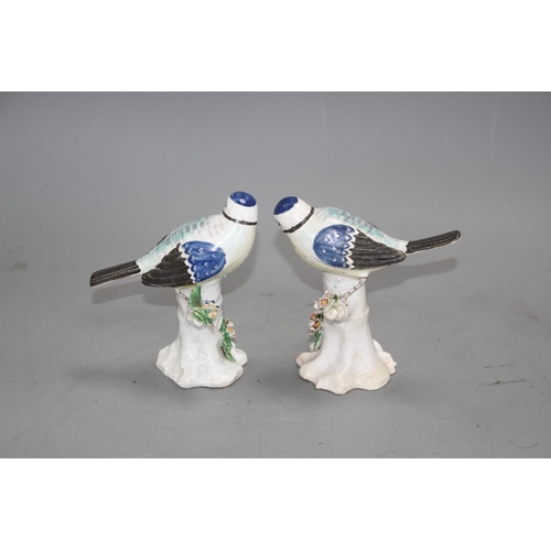 95 - A pair of Derby figures of blue tits on tree stumps, c.1765-70, height 11.7cm and 11.5cm Note: Ex Ch... 