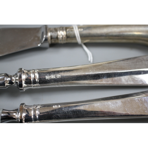 198 - A modern 4 piece silver handled carving set, Mappin & Webb, Sheffield, 1996, one other silver pistol... 