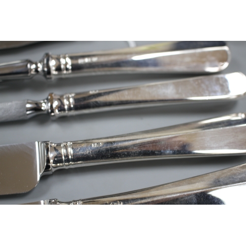 198 - A modern 4 piece silver handled carving set, Mappin & Webb, Sheffield, 1996, one other silver pistol... 