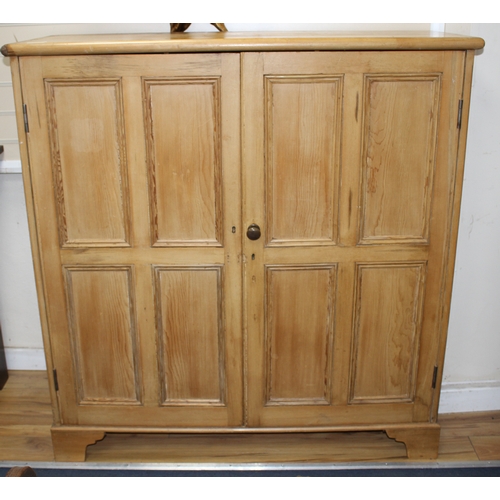 886 - An Edwardian pine boot cupboard, with two panelled doors enclosing a fixed nine division interior, W... 