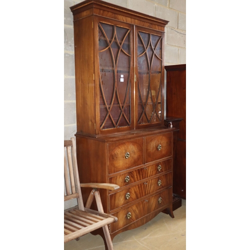 1003 - A Sheraton style mahogany secretaire bookcase, W.100cm, D.46cm, H.220cm