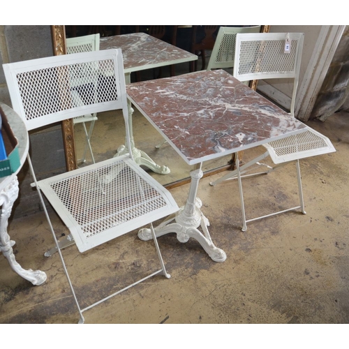1011 - A cast iron garden table with marble top, W.53cm, H.70cm and two metal folding chairs