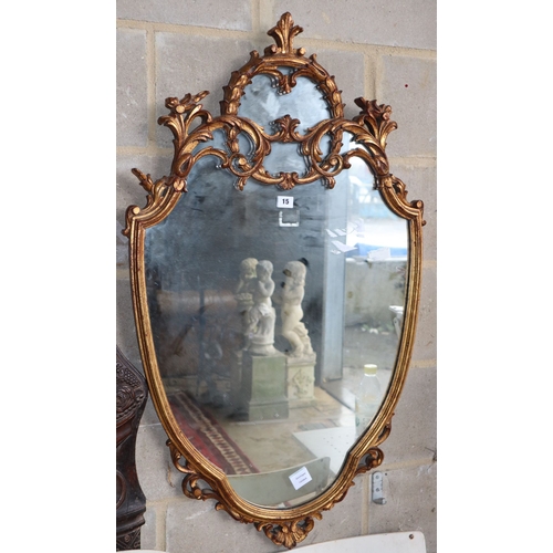 1015 - A reproduction gilt framed shield shaped wall mirror, W.62cm, H.106cm